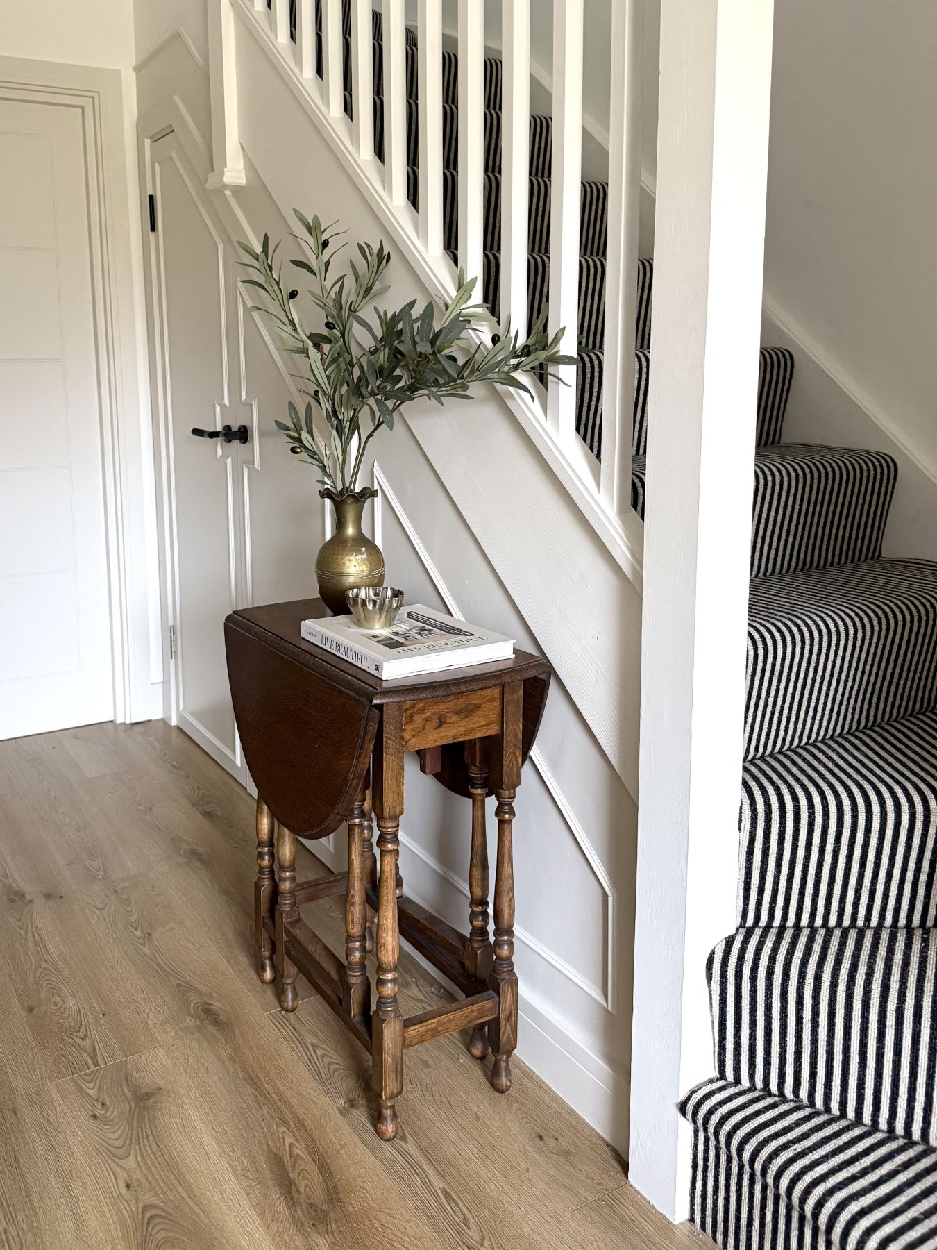 black and cream striped stair carpet on curved staircase
